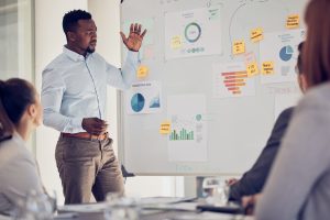 Presentation, whiteboard and businessman with finance strategy, erp marketing analysis and company