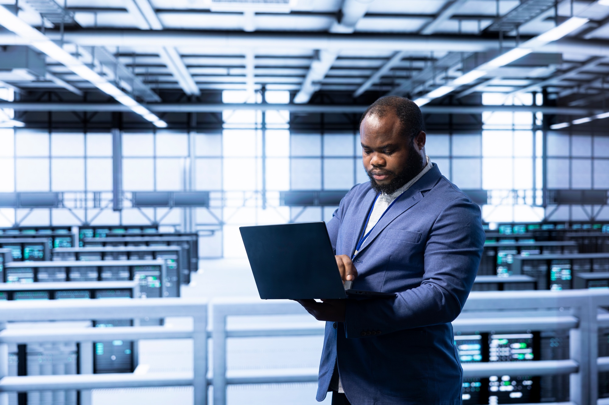 Software developer in data center implementing backup solutions